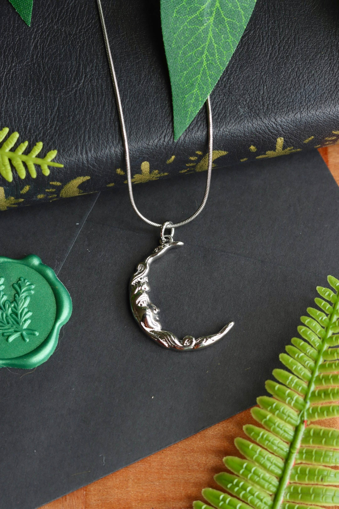 Silver moon face necklace