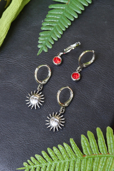 Silver helios sun and red charm huggie set